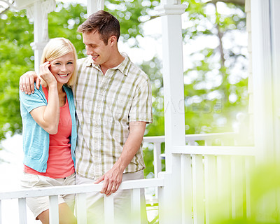 Buy stock photo Happy, hug and love with couple on porch in garden of home for bonding, romance or support. Security, together or trust with smile of man and woman embracing on veranda for moment or relationship