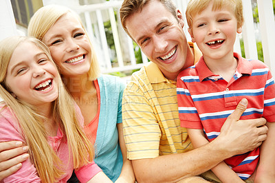 Buy stock photo Shot of a young family of four outside