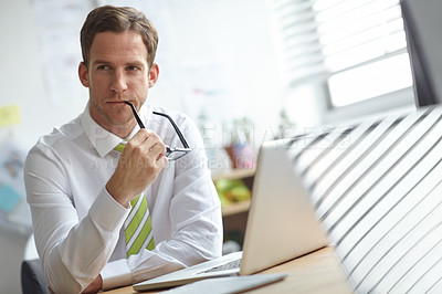 Buy stock photo Man, laptop and reflection with thinking in office for story, proposal and choice at media company. Person, writer and computer for editing, article and biting glasses for solution at news agency