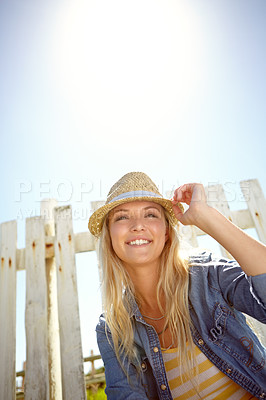 Buy stock photo Woman, hat and blue sky in summer garden, park or mockup lens flare. Sunshine, fashion and female relax at field fence, nature and freedom with happiness in environment for holiday, mock up and smile
