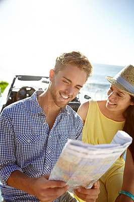 Buy stock photo Adventure, road trip and couple with map by car on summer holiday, vacation and weekend getaway by ocean. Travelling, freedom and man and woman reading paper for directions, navigation and journey