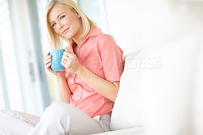 Buy stock photo Portrait, coffee and woman relax on sofa for comfort, peace or calm in home apartment. Break, cup and blonde person with drink in living room for energy, morning espresso or confidence in Switzerland