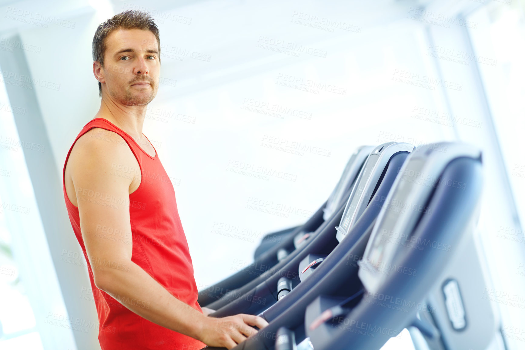 Buy stock photo Man, fitness and portrait with treadmill for exercise, workout or cardio training in gym. Runner, athlete or sports person ready with equipment for endurance, body goals and wellness in health club