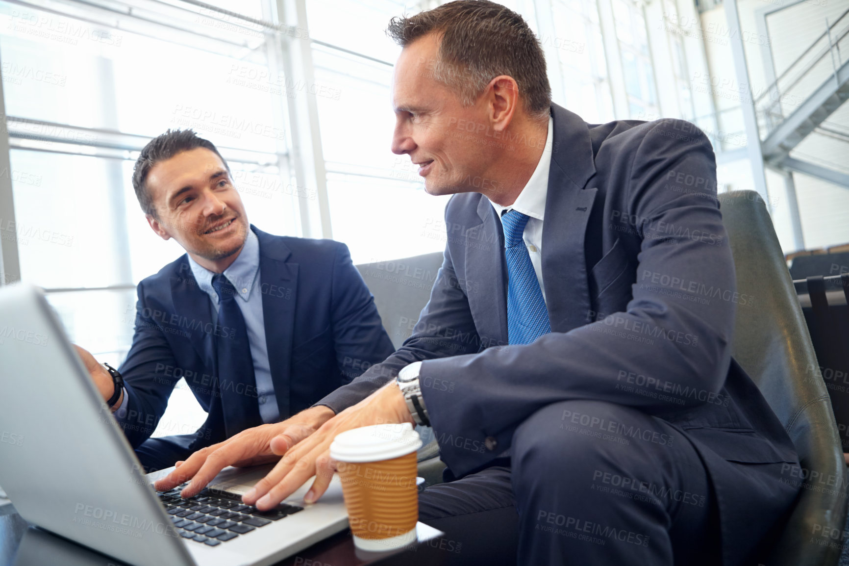 Buy stock photo Planning, laptop and businessman with partner meeting in lobby for digital, website or online company strategy. Corporate business people with management ideas for finance, stock market or investment