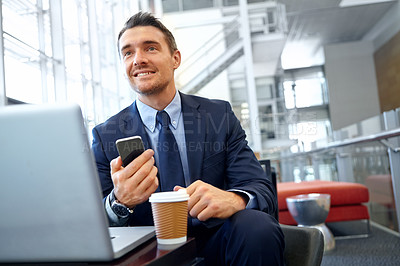 Buy stock photo Businessman, smartphone and laptop in corporate lounge, thinking and digital marketing. Startup, male entrepreneur and ceo with cellphone, social media and planning for advertising and modern office