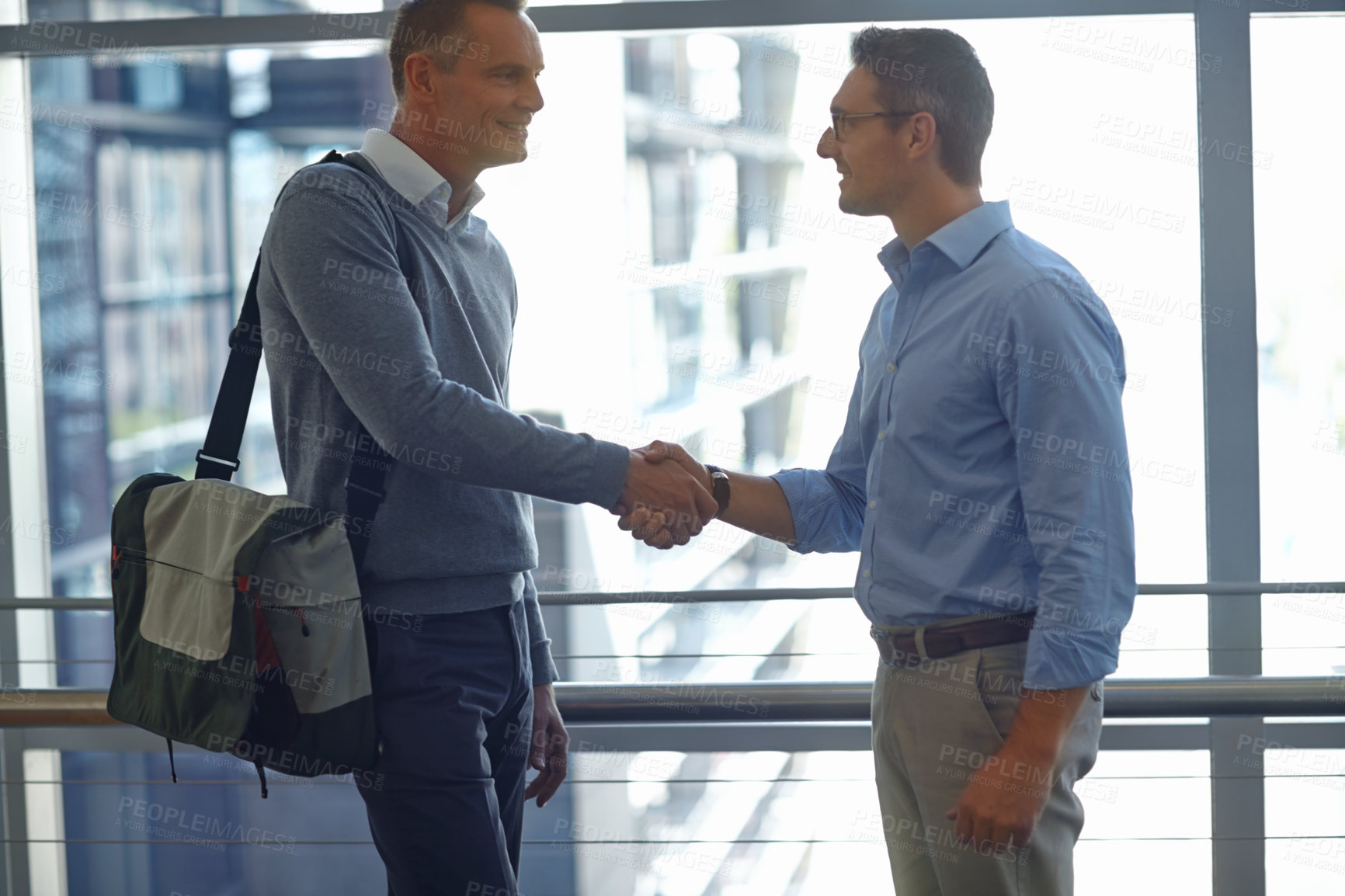 Buy stock photo Mature men, handshake or partnership deal in hotel lobby or modern office for financial crm success. Smile, happy or corporate workers shaking hands in welcome, b2b thank you or business greeting