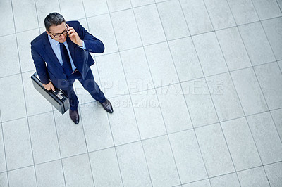 Buy stock photo Top view, phone call and communication with business man in airport lobby for loan, financial and invest negotiation. Travel, standing and manager on smartphone for networking, talking and mockup