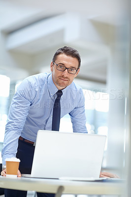 Buy stock photo Portrait, laptop and mindset with a business man at work in his office for research or solution. Computer, mission and management of a male employee working on a tech report or planning for success