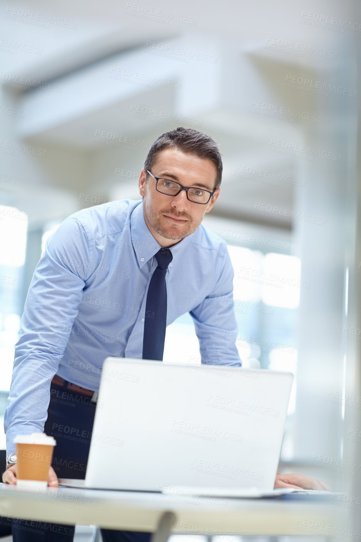 Buy stock photo Portrait, laptop and mindset with a business man at work in his office for research or solution. Computer, mission and management of a male employee working on a tech report or planning for success