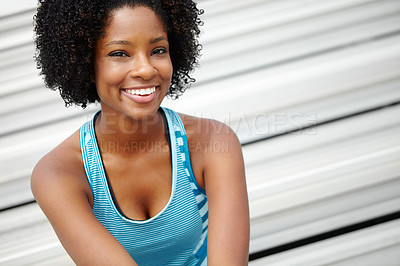 Buy stock photo Close up shot of a female athlete sitting on the rafters and smiling at the camera