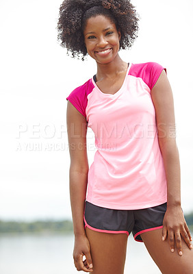 Buy stock photo Cropped portrait of a female athlete smiling widely and standing with her arms at her side