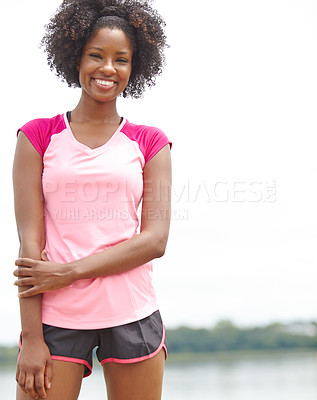 Buy stock photo Cropped portrait of a female athlete smiling widely and standing in a casual stance