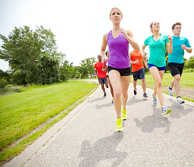 Buy stock photo Front view of a group of male and female runners outdoors