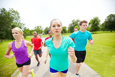 Buy stock photo Cropped front view of a group of athletes running outdoors