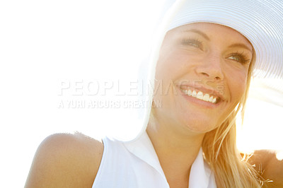 Buy stock photo A happy young woman wearing a large sunhat in a field