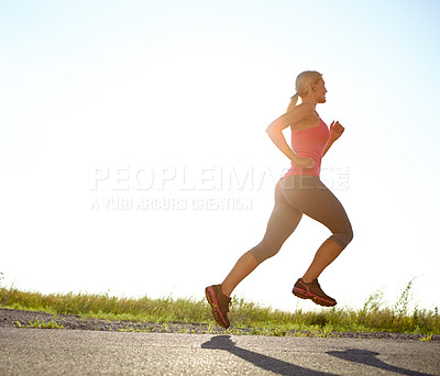 Buy stock photo A young woman running on a sunny day