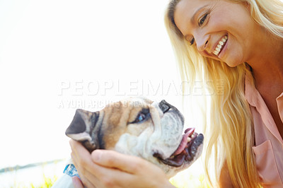 Buy stock photo Companion, cuddle or smile with woman and dog outdoor in park together for bonding, training or walk. Health, vitality or wellness with bulldog and pet owner in nature for summer activity or exercise