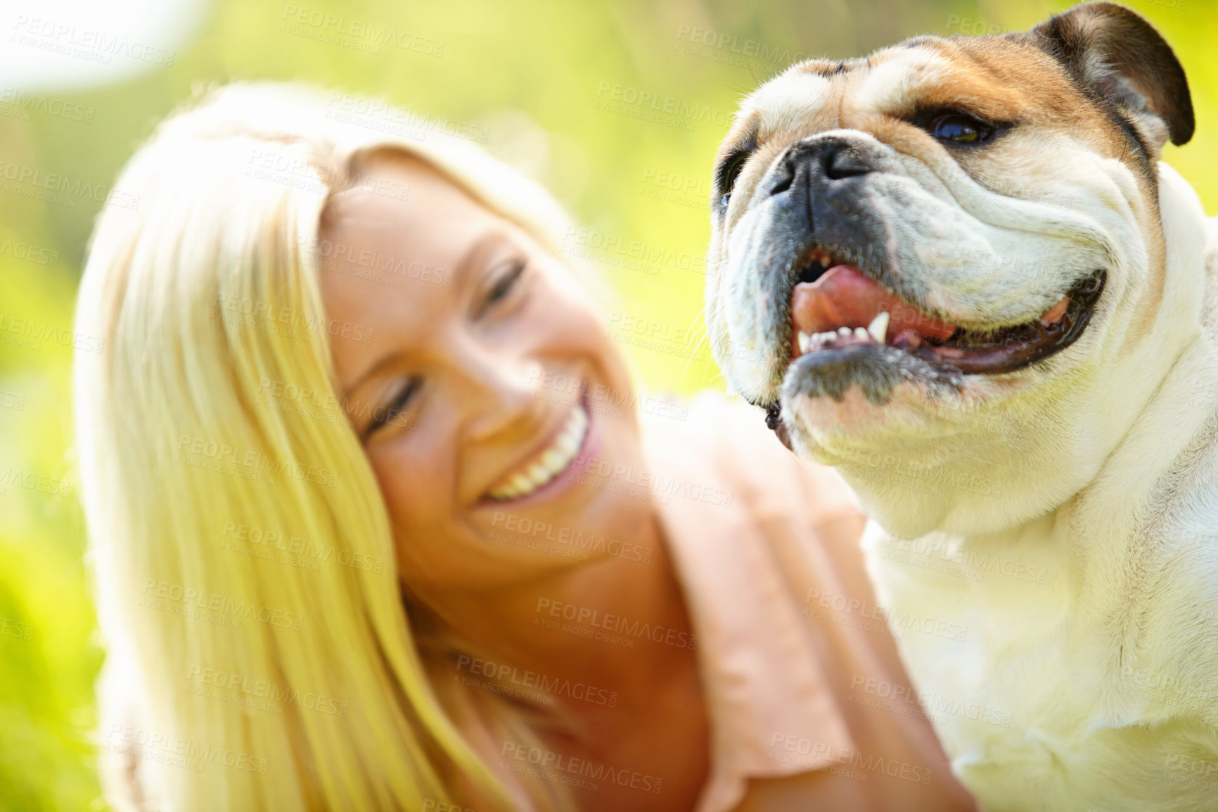 Buy stock photo Companion, happy and woman with pet dog outdoor in park together for bonding, training or walk. Health, vitality or wellness with bulldog and smiling owner in nature for summer activity or exercise