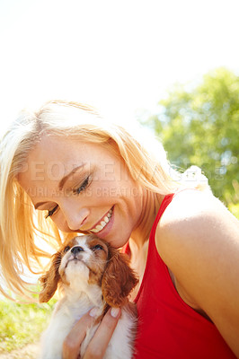 Buy stock photo Woman, smile and puppy in park with hug, pet care and excited for adoption approval. Person, dog companion and happy in nature with support animal, new best friend and bonding for anxiety relief