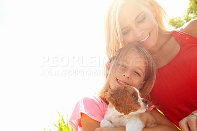 Buy stock photo Portrait of a mother, daughter and puppy at bliss in the outdoors