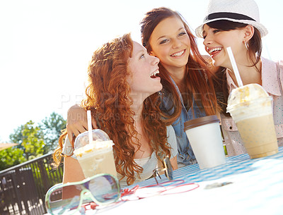 Buy stock photo A group of adolescent girls enjoying smoothies at an outdoor cafe