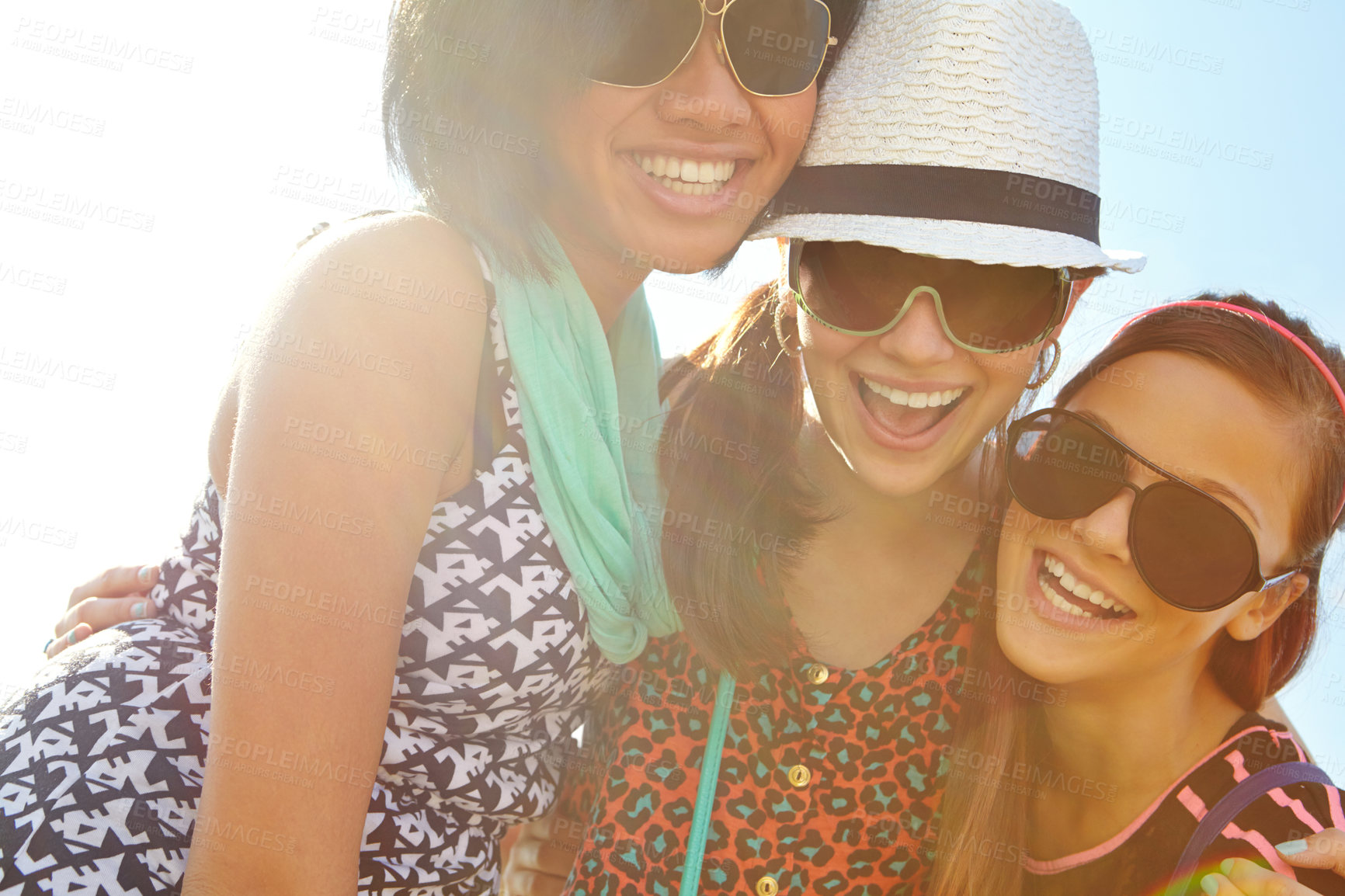 Buy stock photo Closeup shot of a group of teenage girls smiling with their arms around each other's shoulders