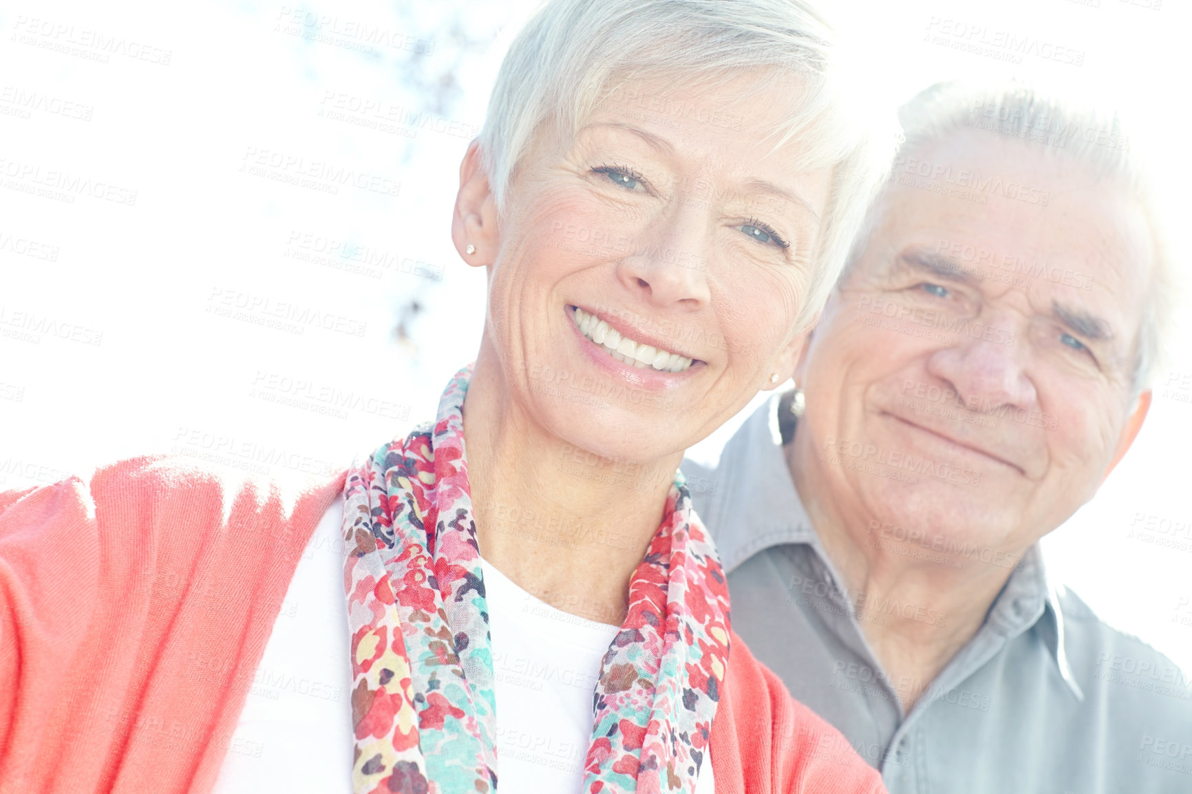 Buy stock photo A loving elderly couple smiling at the camera