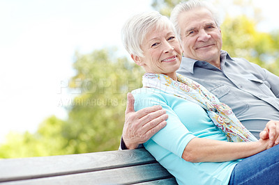 Buy stock photo Love, portrait and senior couple at park on bench for relationship, connection and relax together. Retirement, happy man and woman embrace outdoor for support, care and marriage on valentines day