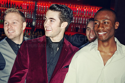 Buy stock photo A group of smartly dressed men arriving at a nightclub together