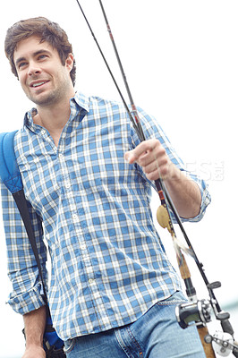 Buy stock photo Happy man, fisher and walking with fishing rod or backpack for water sport, hobby or catch by ocean. Male person, fisherman or smile with bag or pole for trap, bait or outdoor sea activity by beach