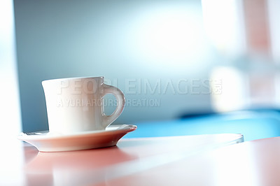 Buy stock photo Closeup of an espresso cup sitting in a saucer