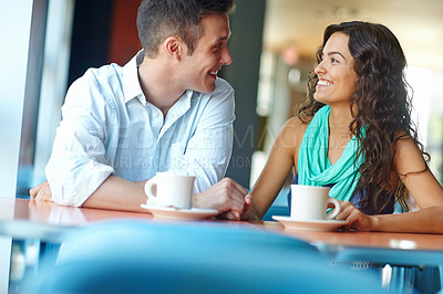 Buy stock photo A young couple enjoying a casual date over coffee