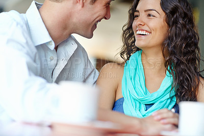 Buy stock photo Happy couple, holding hands and laugh at cafe for talk, bonding or love with funny joke in morning. Man, woman and support with conversation, drinks or tea with smile, memory or trust at coffee shop