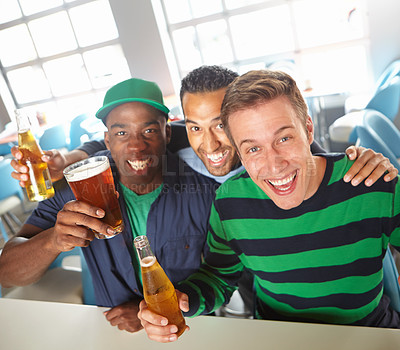 Buy stock photo Top view of a three friends unwinding at the bar with beer