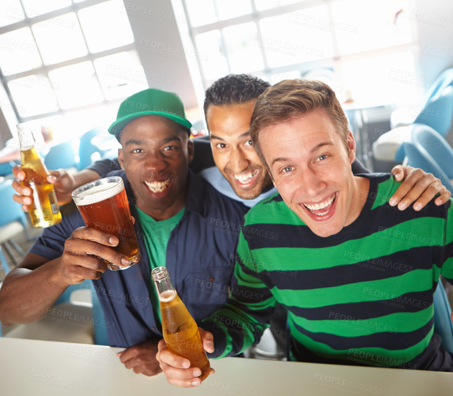 Buy stock photo Top view of a three friends unwinding at the bar with beer