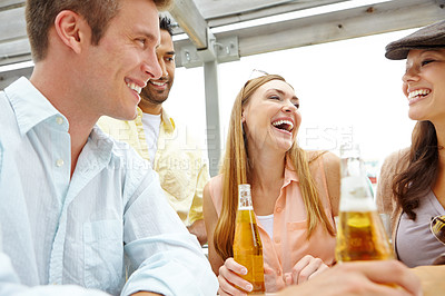 Buy stock photo A group of friends drinking and having a good time at a restaurant