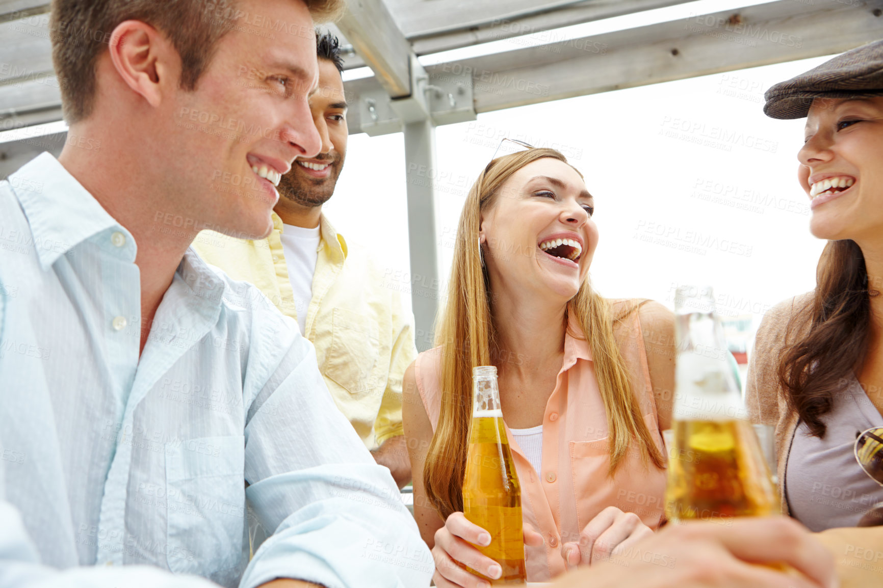 Buy stock photo A group of friends drinking and having a good time at a restaurant