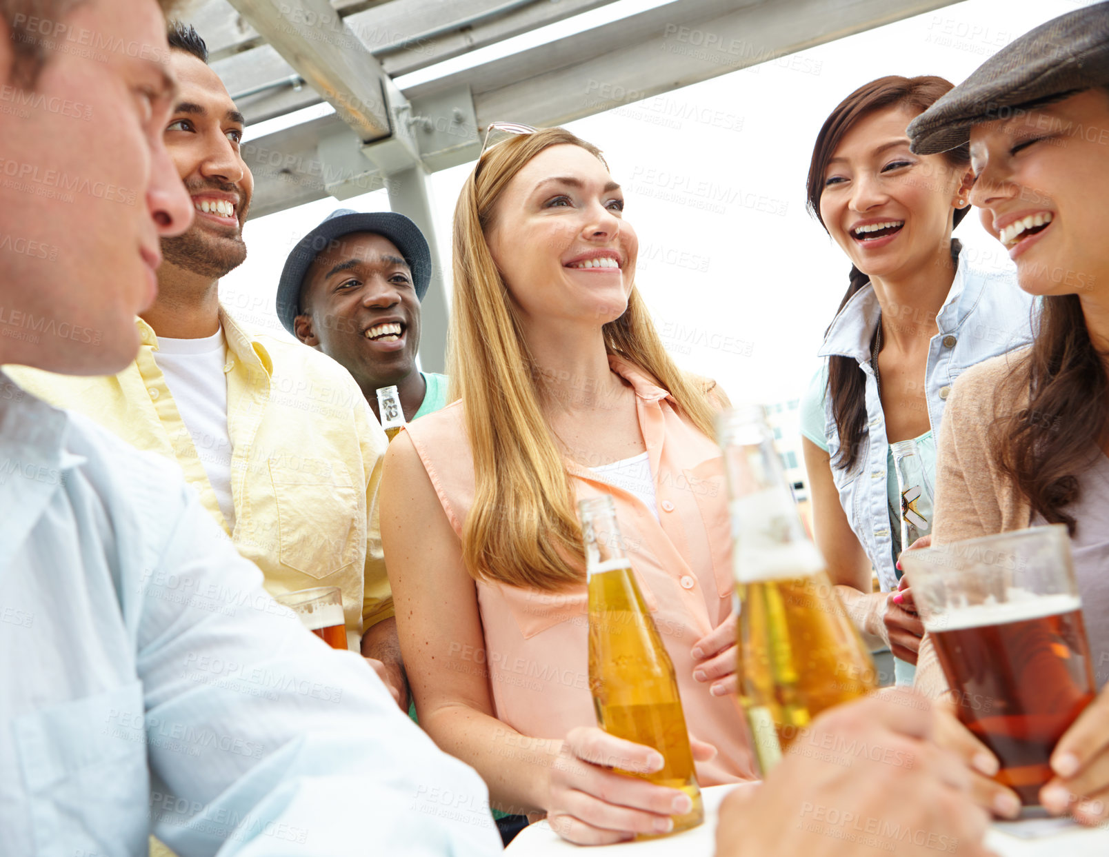 Buy stock photo A group of friends drinking and having a good time at a restaurant