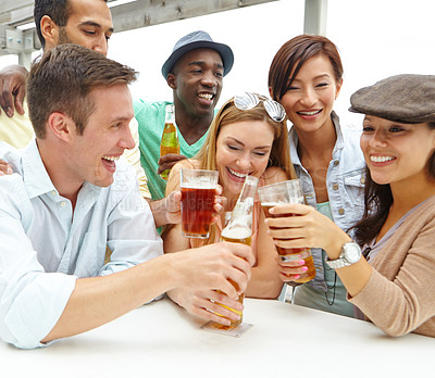 Buy stock photo A group of friends drinking and having a good time at a restaurant