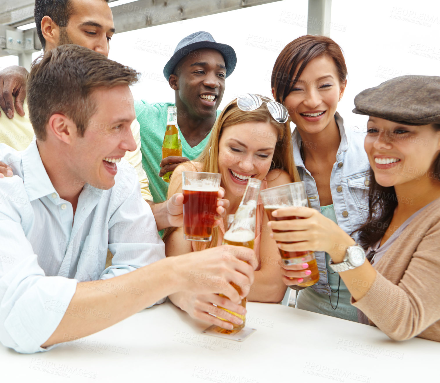 Buy stock photo A group of friends drinking and having a good time at a restaurant