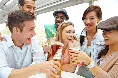 Buy stock photo A group of friends drinking and having a good time at a restaurant