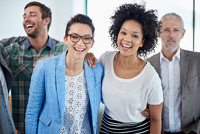 Buy stock photo Portrait of a group of happy coworkers standing in an office