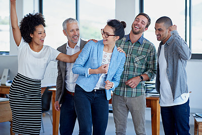 Buy stock photo Shot of a group of happy coworkers celebrating standing in an office