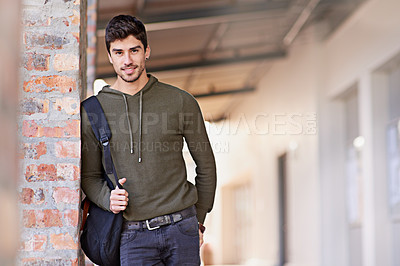 Buy stock photo Male college student, smile and portrait on campus or university for education, higher learning or study. Young guy, happy and standing outdoor with bag for educational class with mockup space