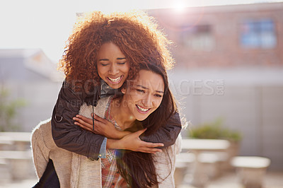 Buy stock photo Friends, piggyback and women are happy outdoor, playful and fun for bonding, support and loyalty. Laughing, humor or comedy with energy, freedom and crazy together, trust and love in friendship