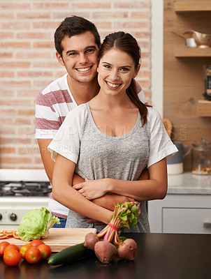Buy stock photo Portrait, happy and couple hug in kitchen for cooking, wellness and love in house together. Proud man, woman and food at home for healthy, diet and bonding for commitment, romance and vegan diet.