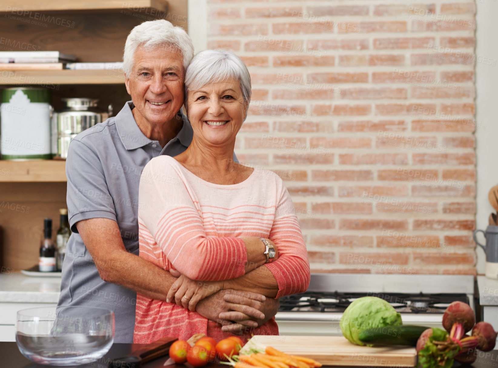 Buy stock photo Cooking, hug and portrait of old couple in kitchen for salad, love and nutrition. Happy, smile and retirement with senior man and woman cutting vegetables at home for food, dinner and recipe