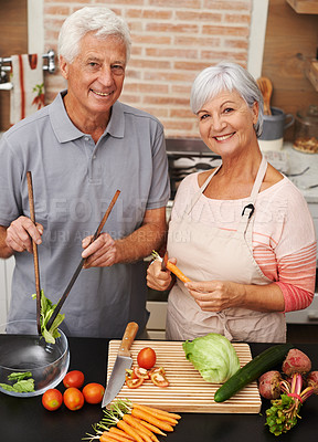 Buy stock photo Cooking, health and smile with portrait of old couple in kitchen for salad, love and nutrition. Happy, help and retirement with senior man and woman eating at home for food, dinner and recipe