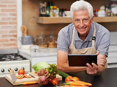 Buy stock photo Portrait, senior man and tablet in kitchen with vegetables for cooking video, knife and health. Tech, food and face of mature person in home for salad recipe with retirement, vegan diet and online