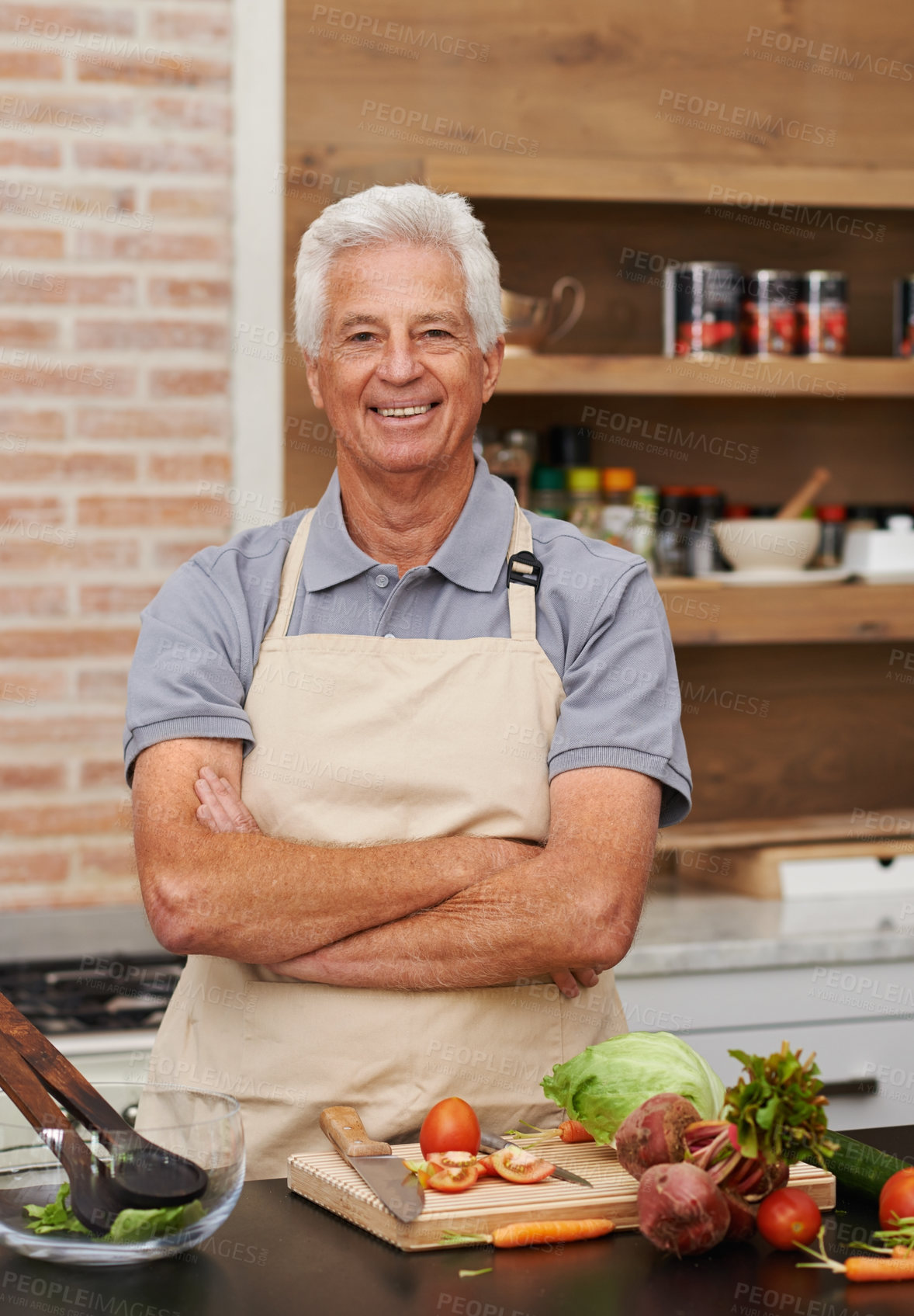 Buy stock photo Senior man, portrait and arms crossed in cooking, food and vegetables with apron and smile in kitchen. Mature person, happy and preparing meal at home for nutrition, healthy and eating in retirement